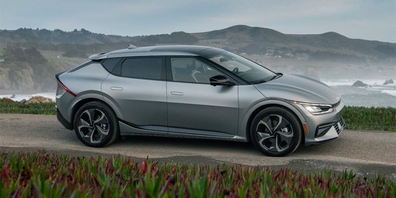 2024 Kia EV6 on Road with Misty Mountains
